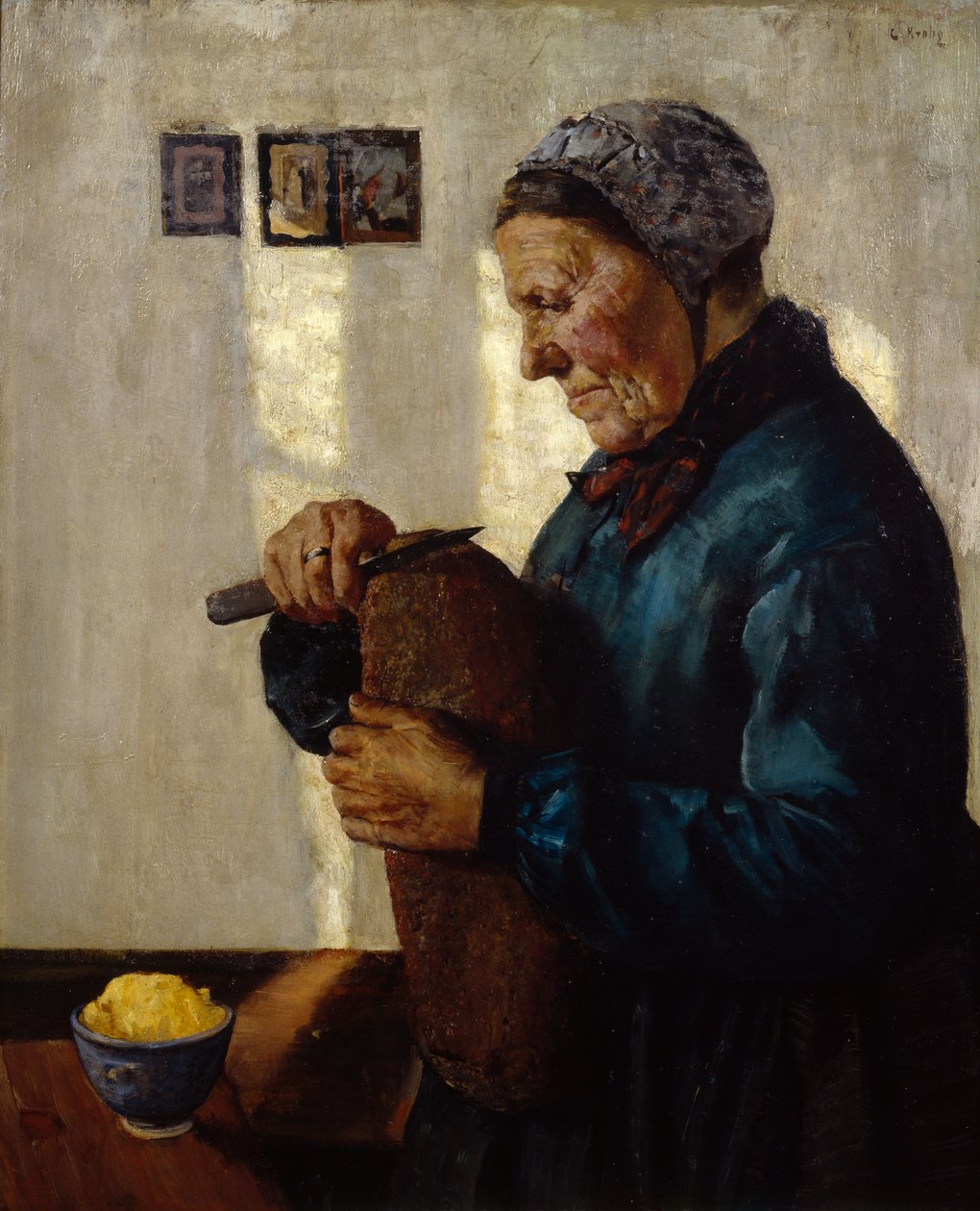 Manželka krájí chléb od Christian Krohg