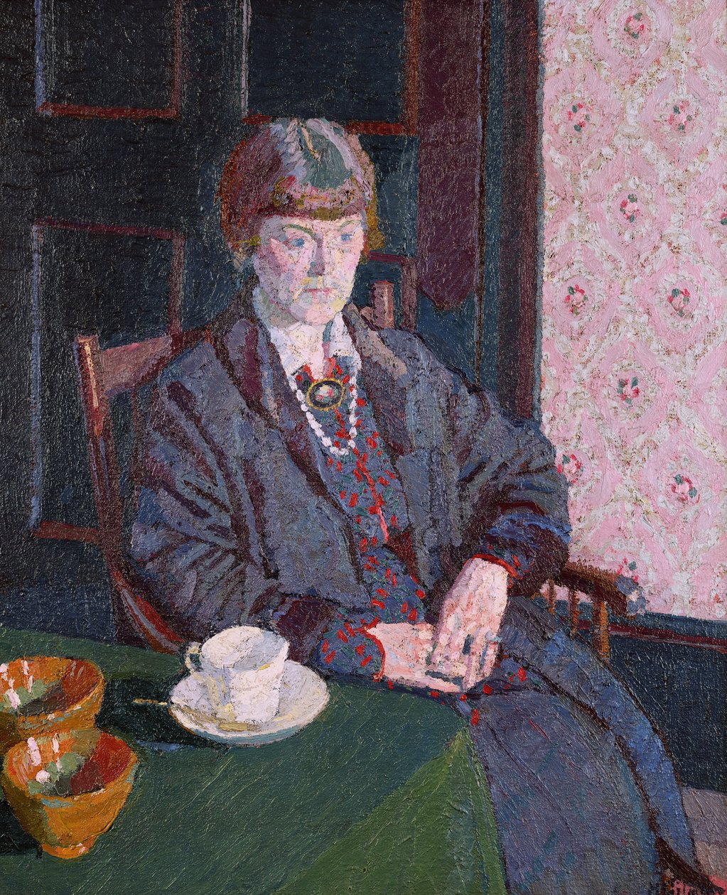 Žena sedí u stolu od Harold Gilman