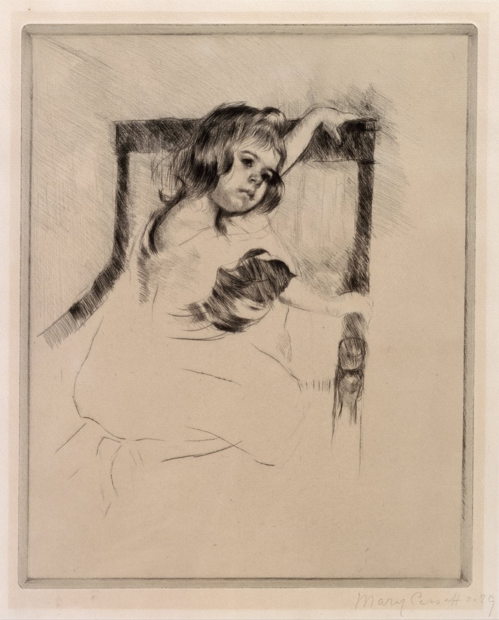 Klečící v křesle od Mary Cassatt
