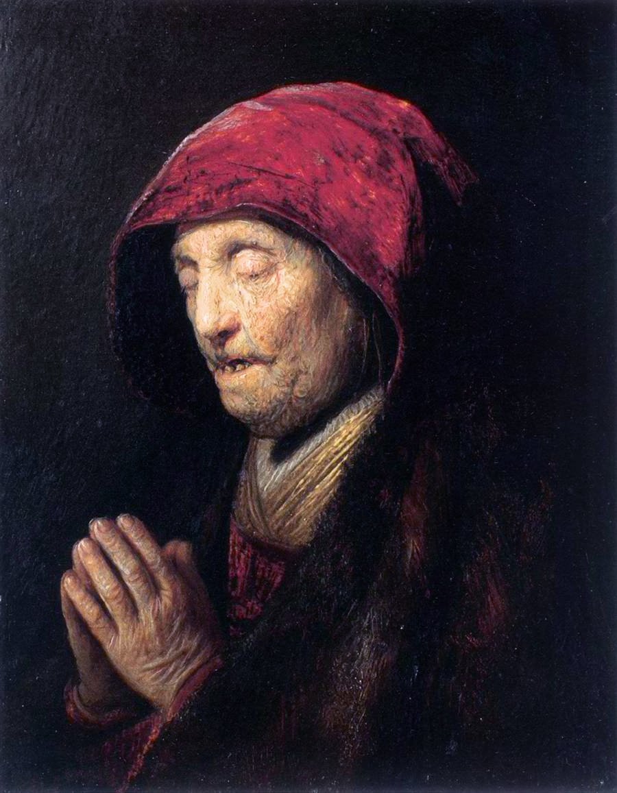 Stará žena se modlí od Rembrandt van Rijn