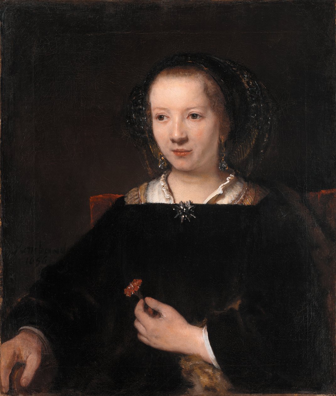Mladá žena s karafiátem od Rembrandt van Rijn