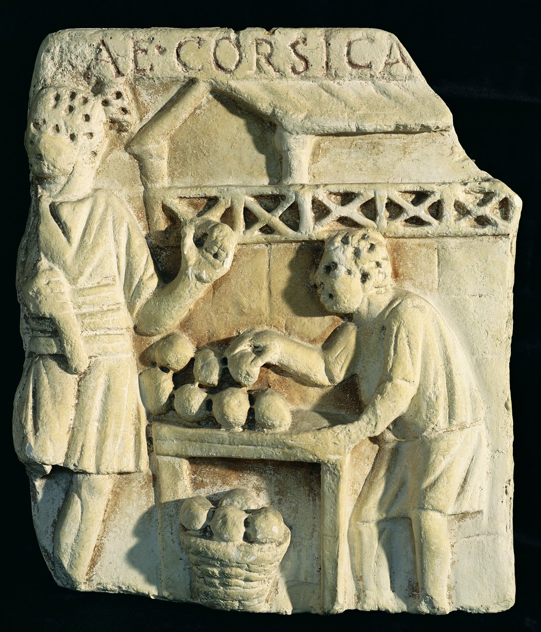 Reliéf zobrazující prodavače chleba od Roman