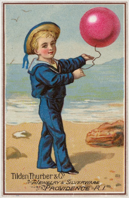 Sailor Boy drží červený balónek od American School